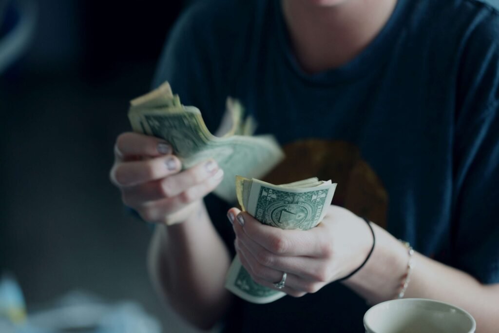 cash holding woman